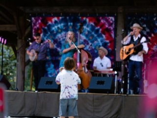 A photo of a youngster enjoying the band on stage