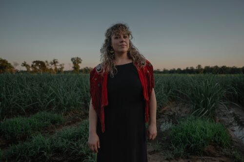 A photo of Andrina Turenne posing outdoors.