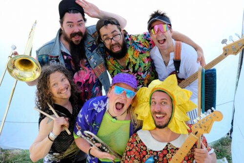 Bu Von Blume posing in a photo with their instruments.